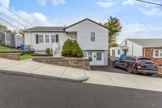 a view of a car park in front of house