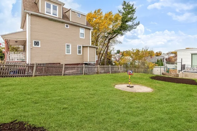a view of a house with a backyard