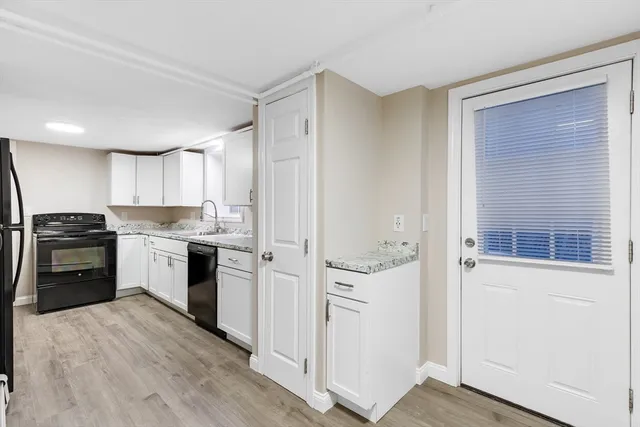 a kitchen with a refrigerator stove and a sink