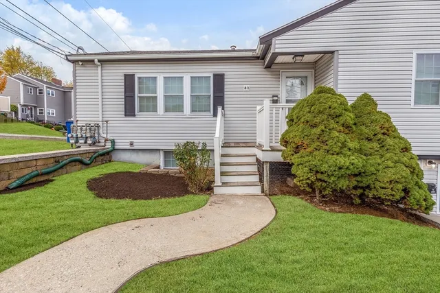 a front view of a house with garden