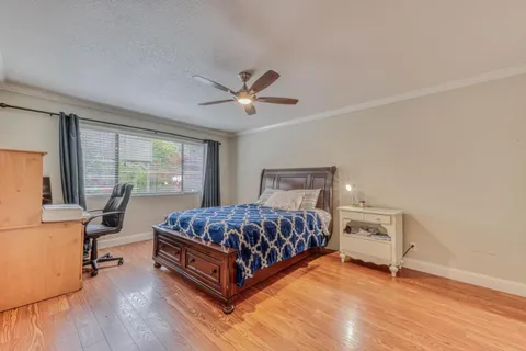 a bedroom with a large bed and a window