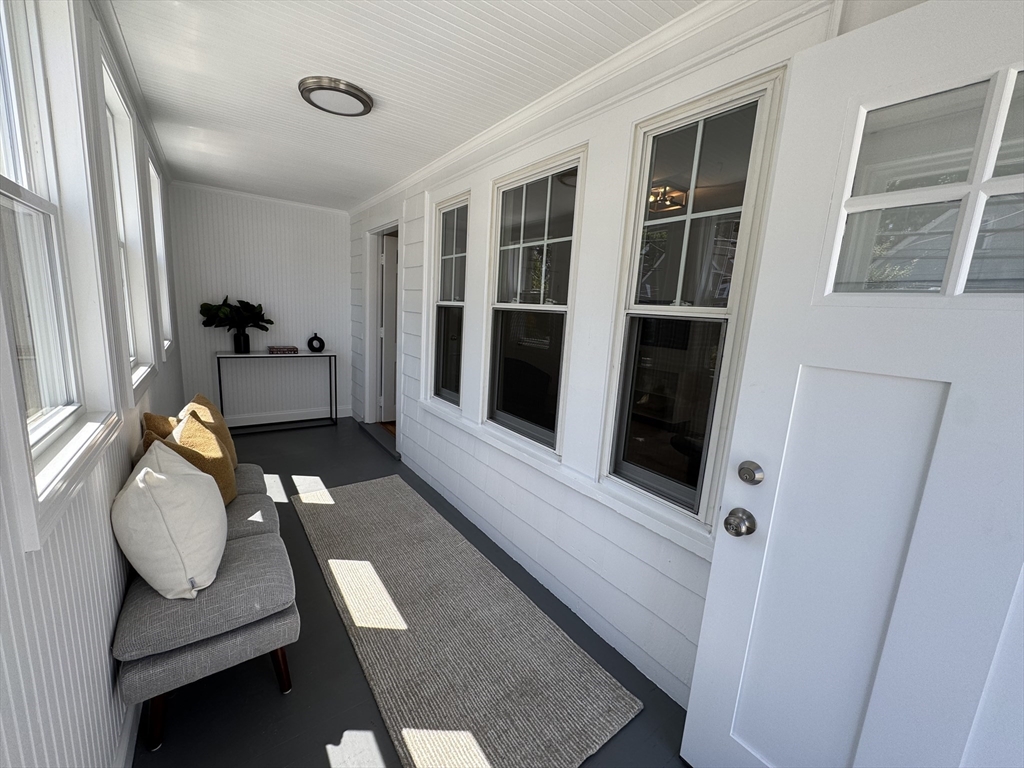331 Vermont Street, Unit 1 Boston, MA 02132 - Photo 2 of 8 a living room with furniture