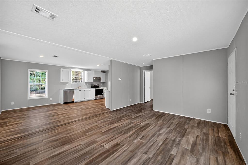 134 Weerts Road San Mateo, FL 32187 - Photo 14 of 32 a view of empty room with wooden floor and window