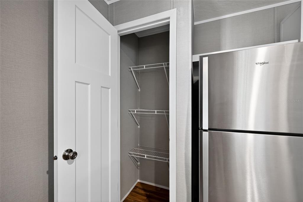 134 Weerts Road San Mateo, FL 32187 - Photo 25 of 32 a metallic refrigerator freezer and a refrigerator in a kitchen