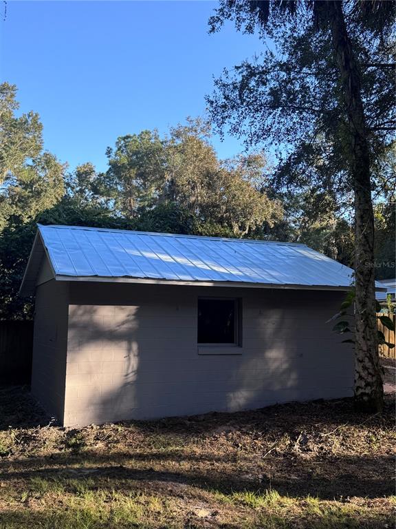 134 Weerts Road San Mateo, FL 32187 - Photo 30 of 32 a view of house with backyard