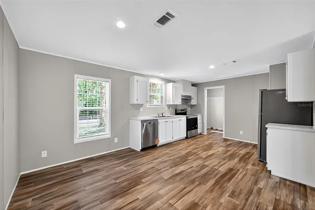 a kitchen with a white cabinets and white appliances