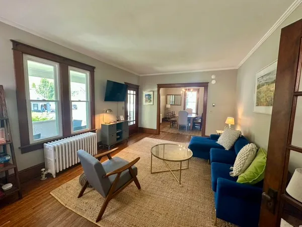 a living room with furniture and a window