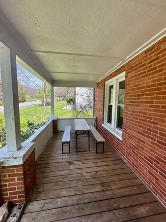 a view of a living room and wooden floor
