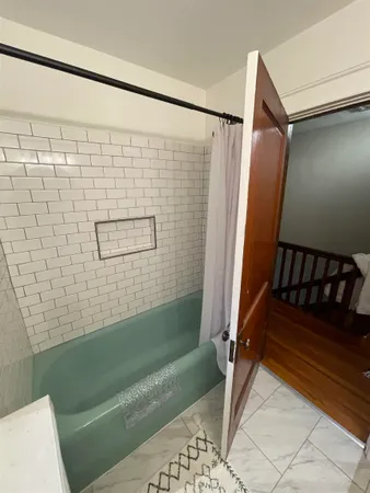 a bathroom with a shower and a toilet