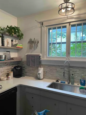 a kitchen with a sink and a window