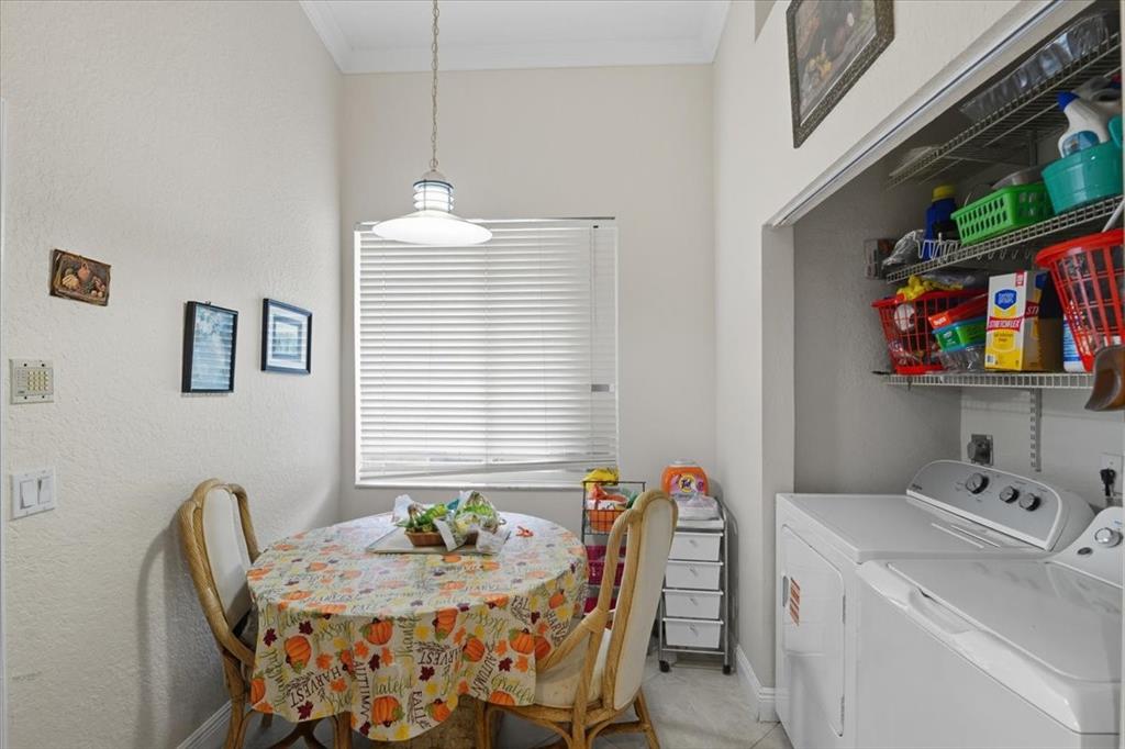 7631 Northwest 87th Terrace Tamarac, FL 33321 - Photo 20 of 23 a dining room with furniture and window