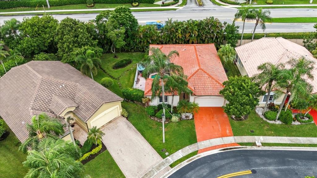 7631 Northwest 87th Terrace Tamarac, FL 33321 - Photo 2 of 23 an aerial view of a house with garden space and street view