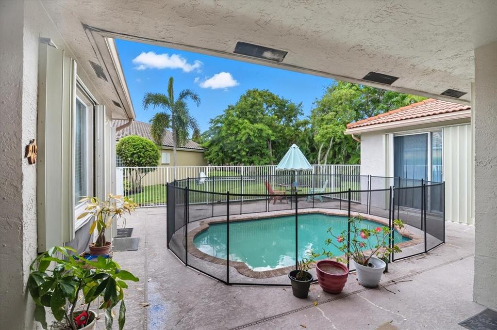 7631 Northwest 87th Terrace Tamarac, FL 33321 - Photo 9 of 23 a house view with a seating space