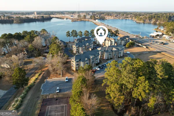 an aerial view of a house with a lake view