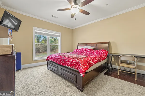 a bedroom with a bed and window