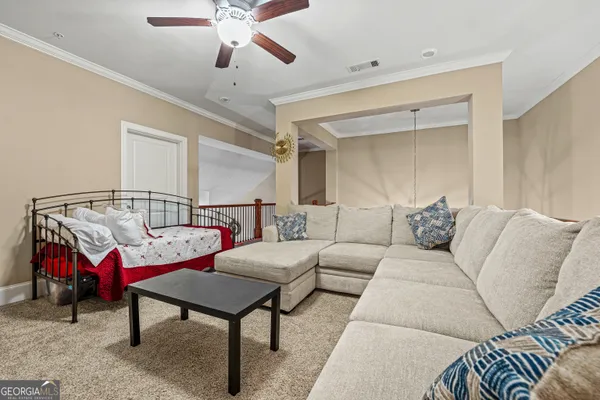 a living room with furniture and a rug