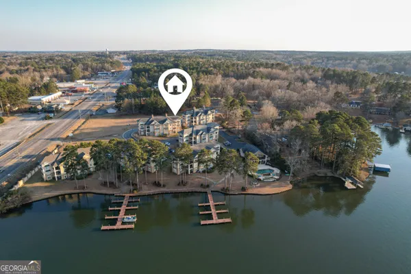 an aerial view of a house with a yard