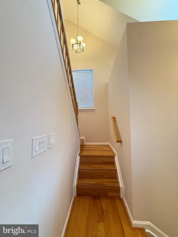 a bathroom with a sink shower and a mirror