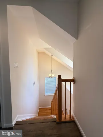 a bathroom with a sink a toilet a mirror and shower