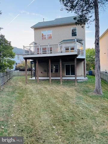 a view of a big yard with an outdoor seating