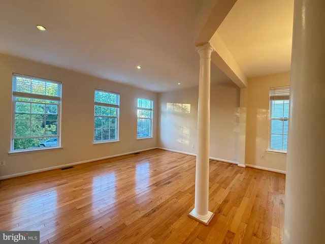 a kitchen with stainless steel appliances granite countertop a stove refrigerator sink and microwave