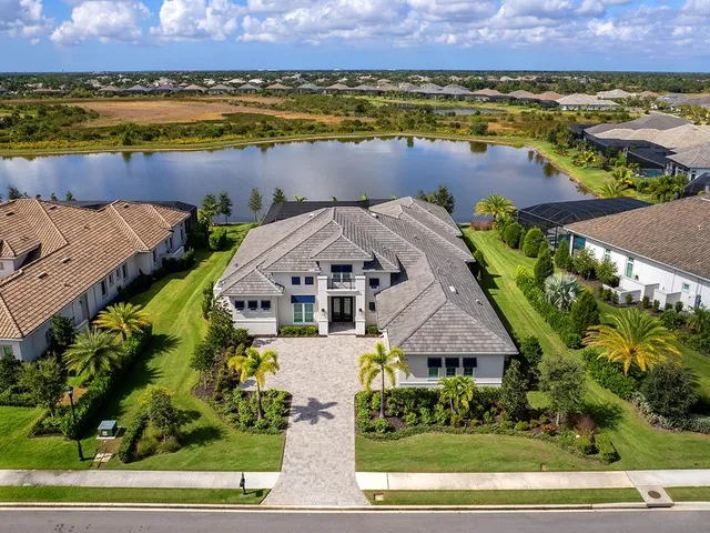 an aerial view of a house with a ocean view