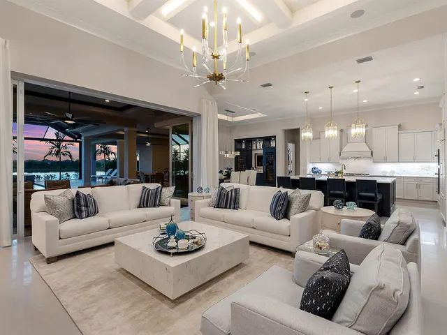 a bedroom with a bed and a lamp on the dresser