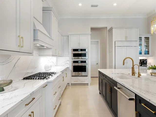 a living room with furniture a chandelier and a flat screen tv