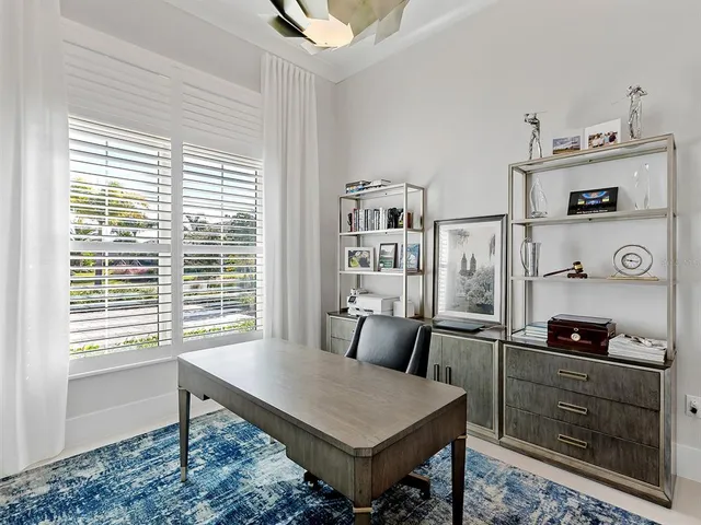 a view of a patio with dining table and chairs with potted plants