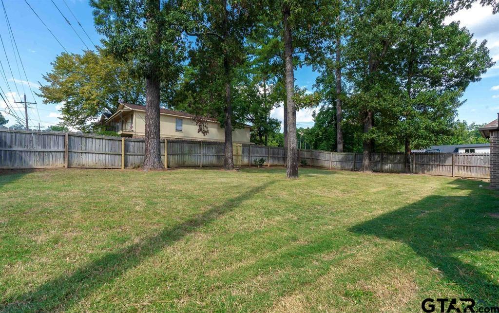 2001 Winding Run Lane Longview, TX 75605 - Photo 16 of 45 a view of a house with a backyard
