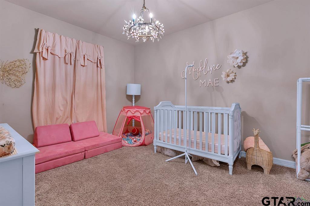 2001 Winding Run Lane Longview, TX 75605 - Photo 21 of 45 a bed room with a bed and a chair