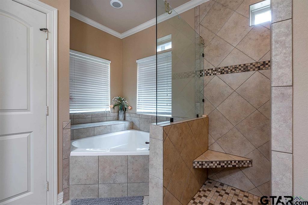 2001 Winding Run Lane Longview, TX 75605 - Photo 26 of 45 a bathroom with a bathtub and shower