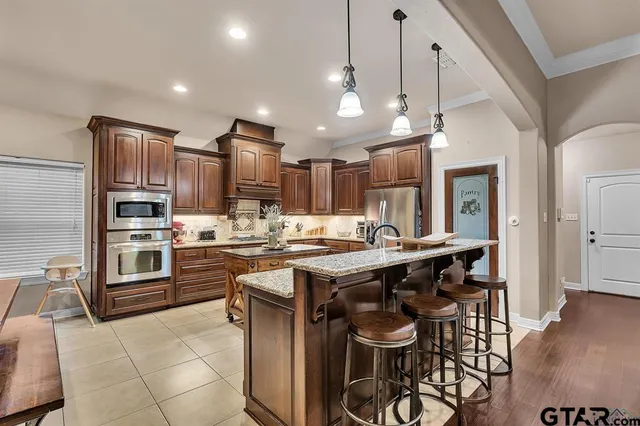 a kitchen with cabinets a sink and appliances