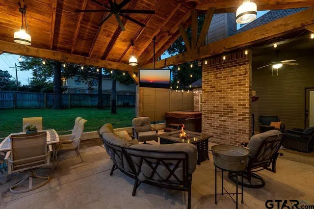 a backyard of a house with table and chairs