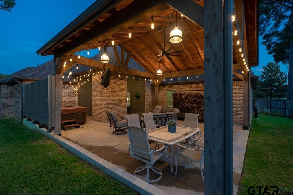 2001 Winding Run Lane Longview, TX 75605 - Photo 6 of 45 a view of a patio with table and chairs with plants and wooden fence