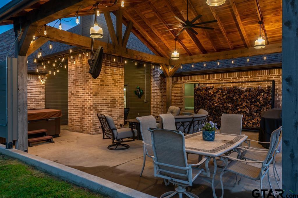 2001 Winding Run Lane Longview, TX 75605 - Photo 7 of 45 a view of a patio with table and chairs and potted plants