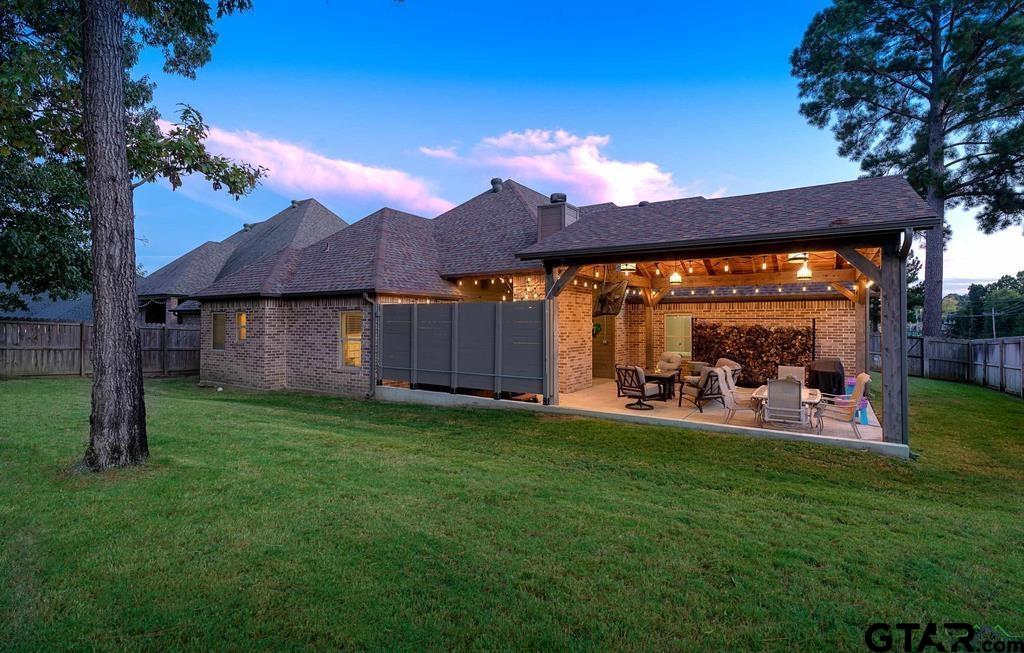 2001 Winding Run Lane Longview, TX 75605 - Photo 9 of 45 a view of a house with backyard porch and sitting area