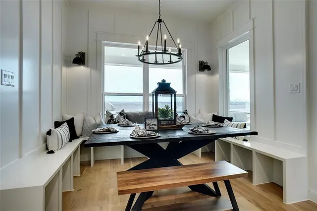 a kitchen with sink a stove and white cabinets
