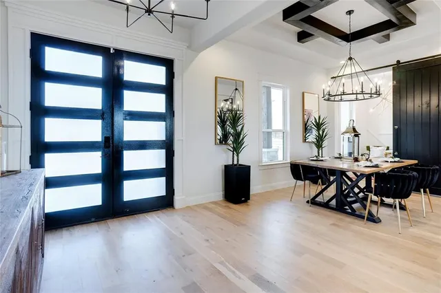 a view of a dining room with furniture and window