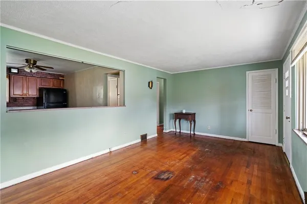 a kitchen with stainless steel appliances granite countertop a stove refrigerator sink and dishwasher with wooden floor