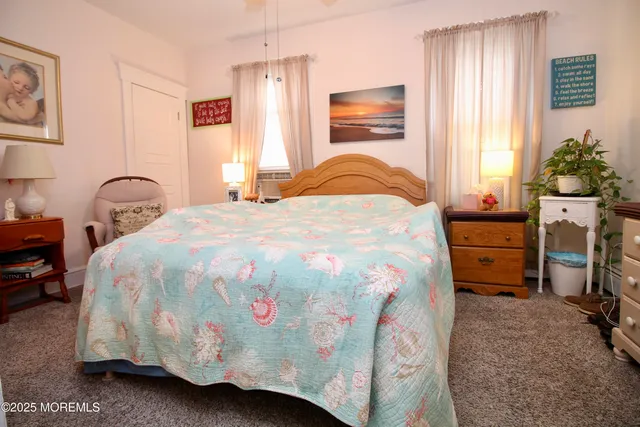 a spacious bedroom with a bed and a window