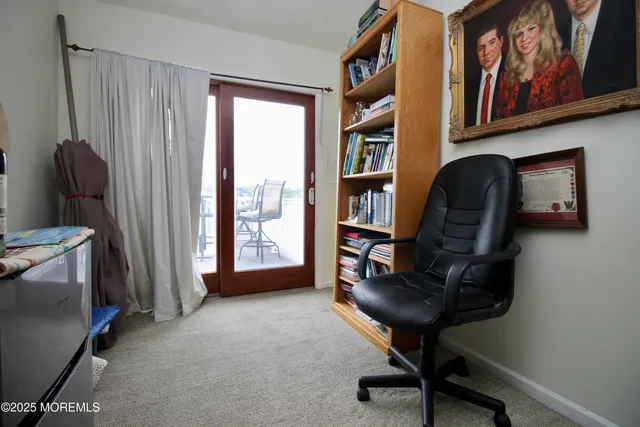 a view of a chairs and table in the balcony