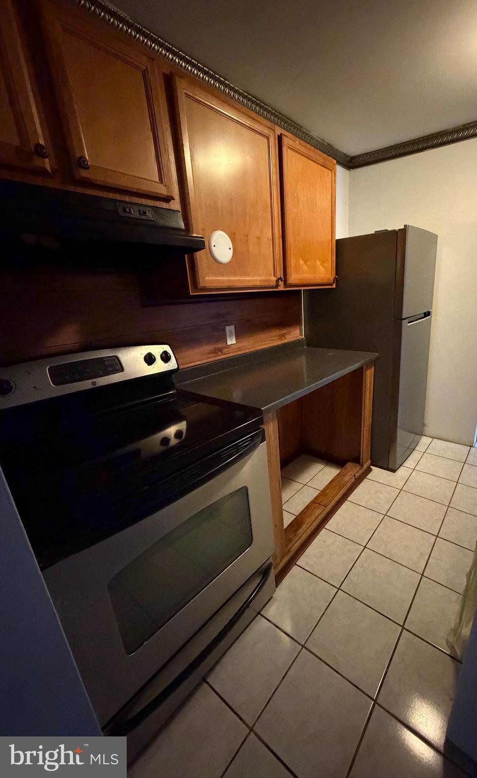 1841 West Lexington Street, Unit 3 Baltimore, MD 21223 - Photo 6 of 14 a stove top oven sitting inside of a kitchen