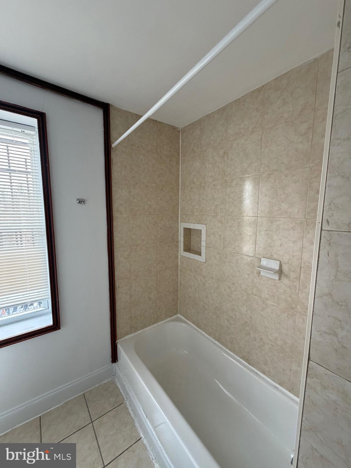 1841 West Lexington Street, Unit 3 Baltimore, MD 21223 - Photo 8 of 14 a bathroom with a tub and shower