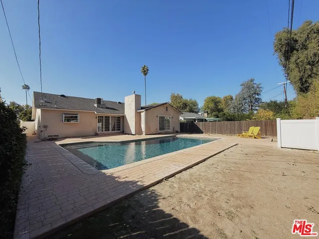 a view of a balcony with two chairs