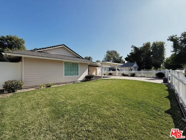 a house with swimming pool in front of it