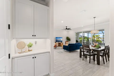 an aerial view of a house with a swimming pool yard and outdoor seating