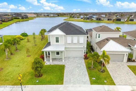 a view of a swimming pool with sitting area