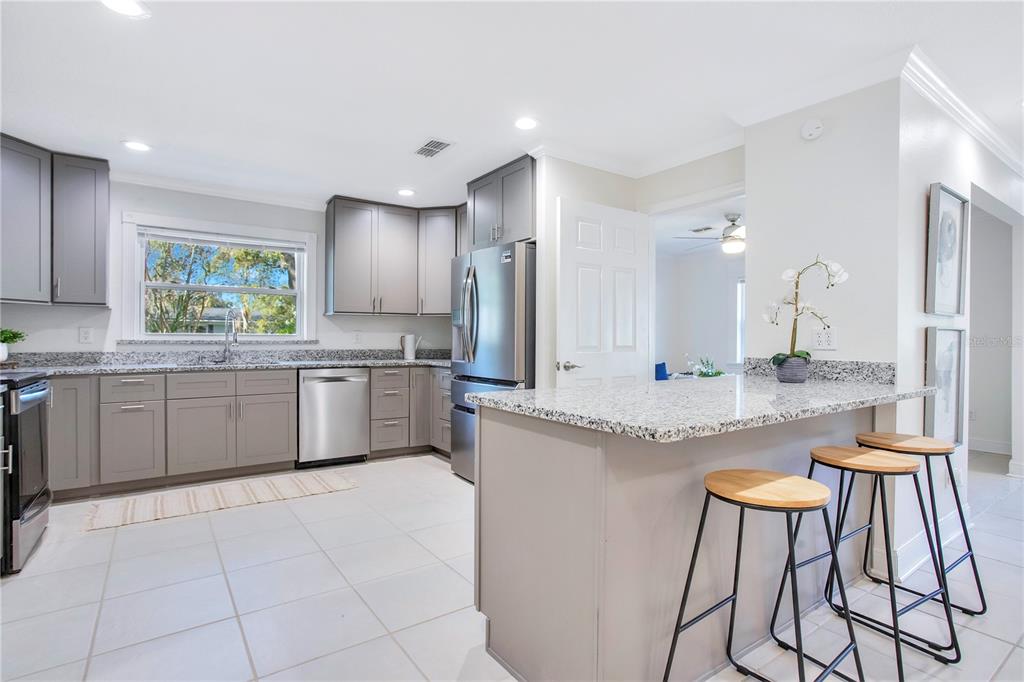 619 Marphil Loop Brandon, FL 33511 - Photo 12 of 36 a large kitchen with a stove a sink and a refrigerator