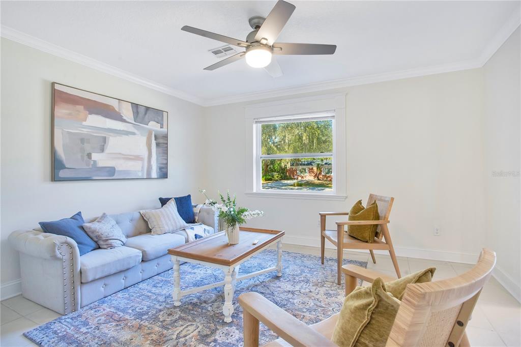 619 Marphil Loop Brandon, FL 33511 - Photo 19 of 36 a living room with furniture a lamp and a window